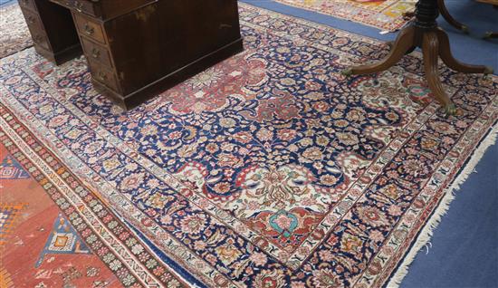 A red and blue Turkish Rug, 345cm x 227cm